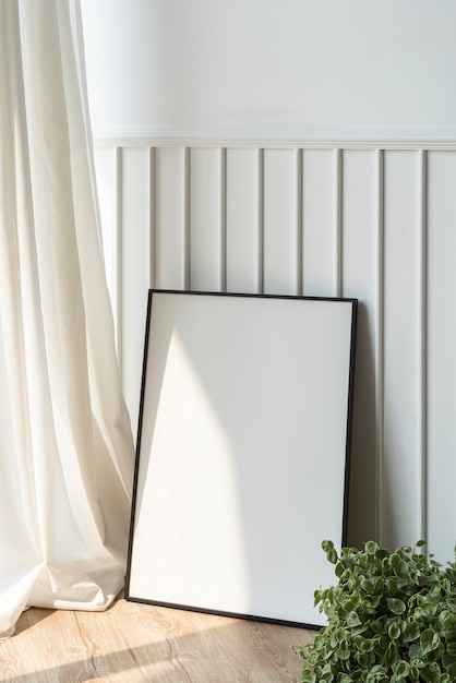 Free Photo blank picture frame on parquet floor